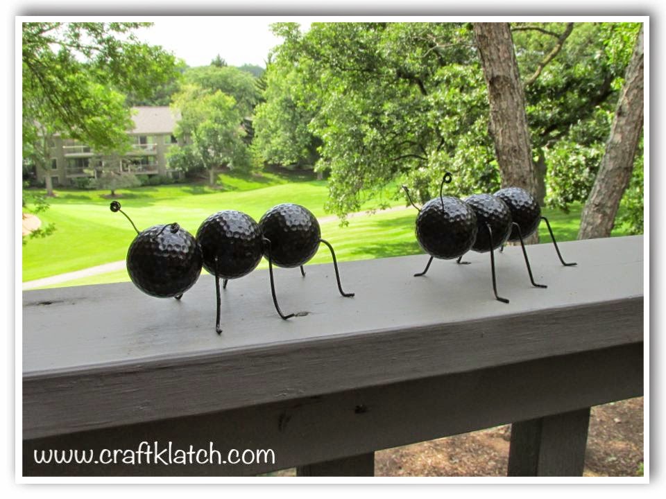 Two giant ants sitting on a deck railing - hard to believe they are made  with recycled materials