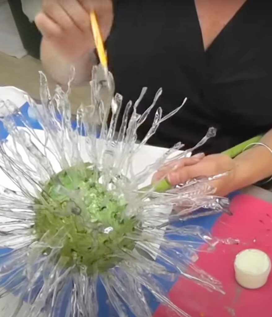 Painting glow in the dark paint on the dandelion wish flower