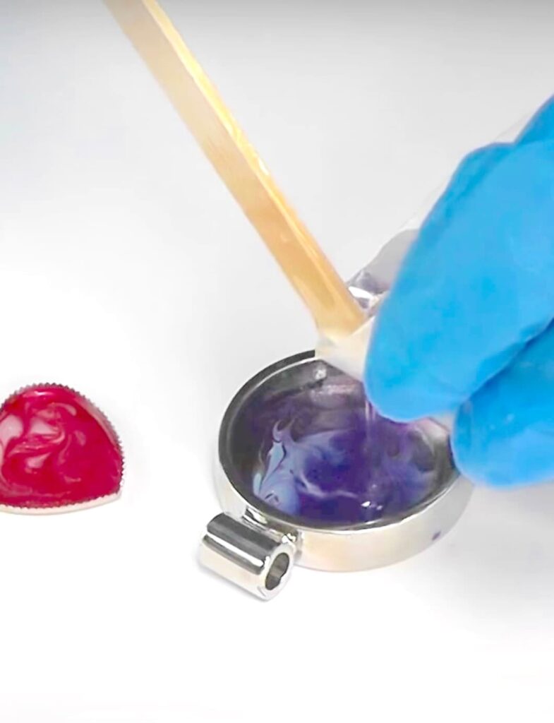 How to make nail polish jewelry | Pour resin into bezel over the nail polish copy