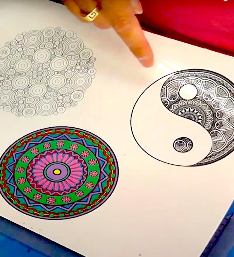 Mandala art printed on transparency film with white paper behind it