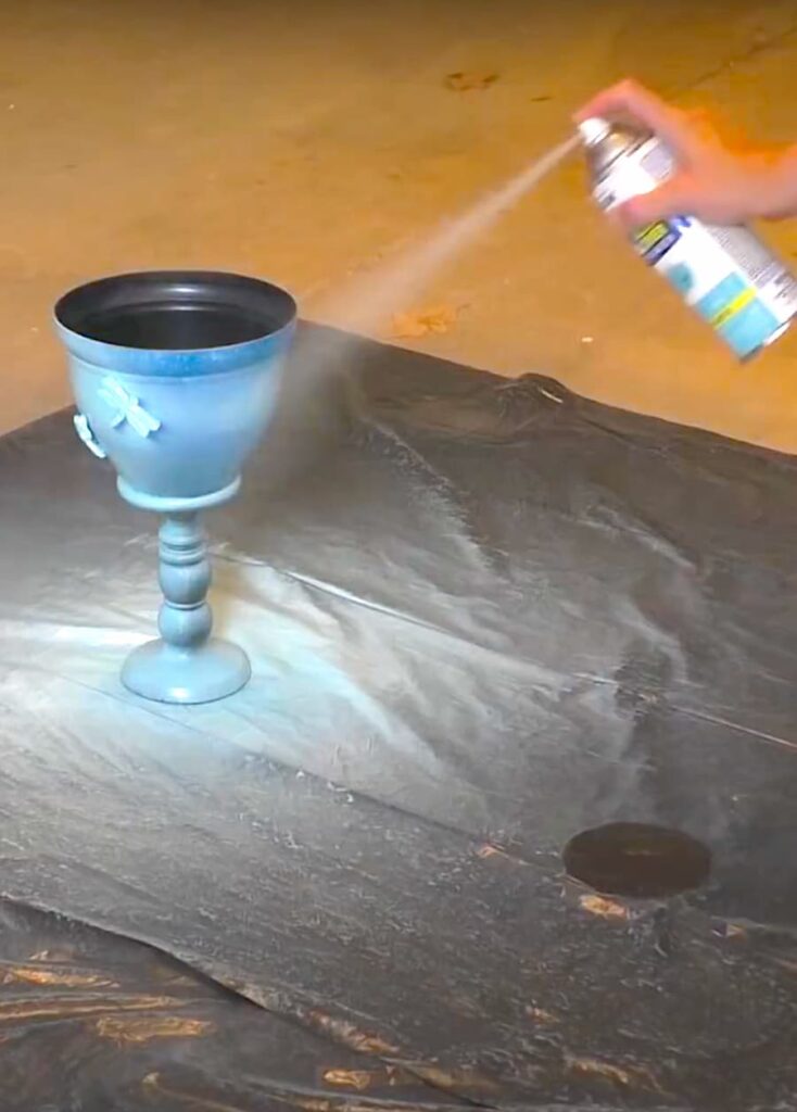 Spray painting the flower pot art dollar tree makeover