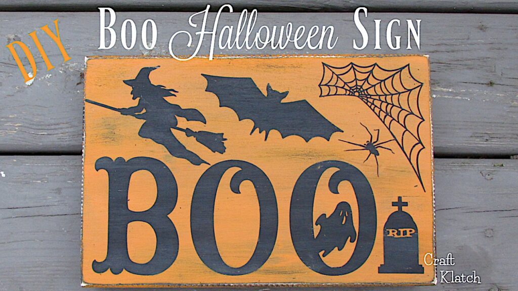 Halloween sign with Boo, witch, bat, spider web