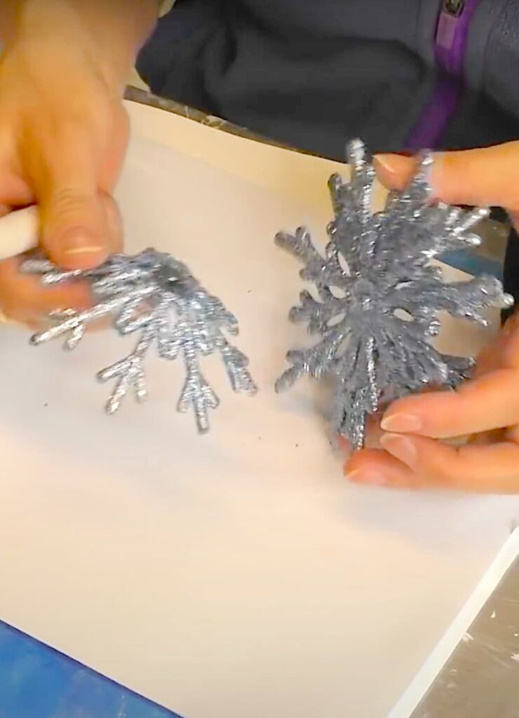 Removing part of the snowflake ornament so it can lay flat