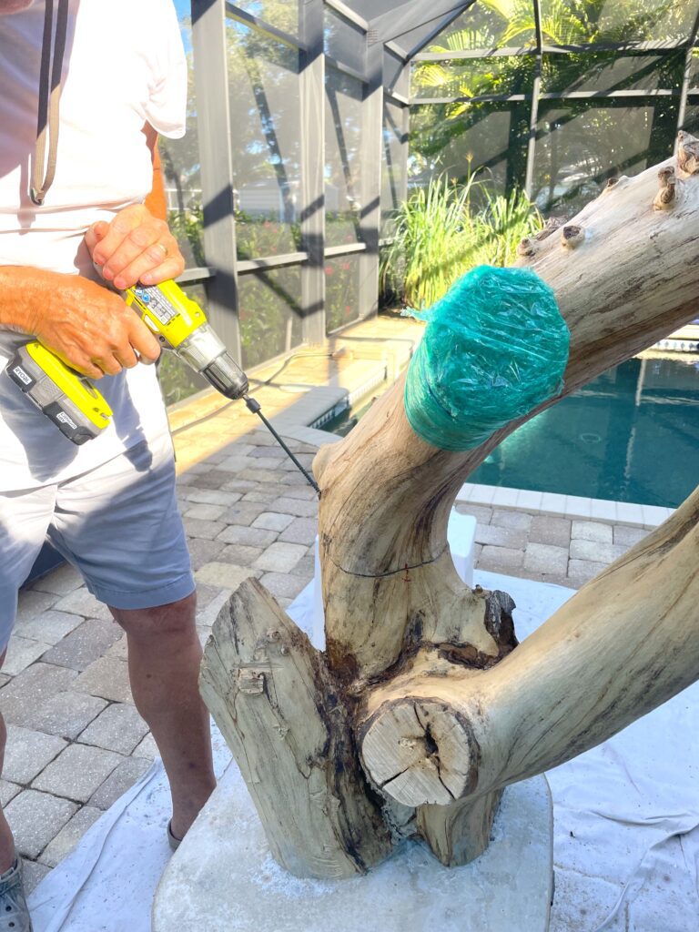 Cat tree diy | driving screws down from one part of the tree limb to another
