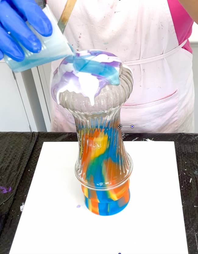 Pouring blue resin on resin flower vase