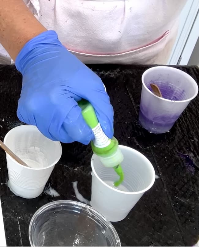 adding lime green resin pigment into cup