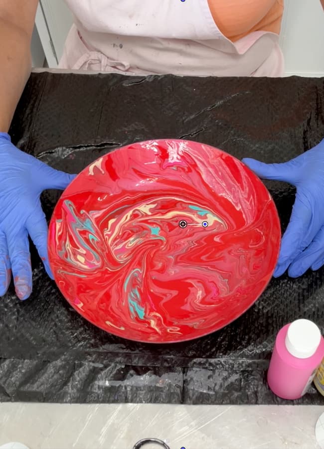 Paint spread over the plant saucer for the mushroom cap for the mushroom decor