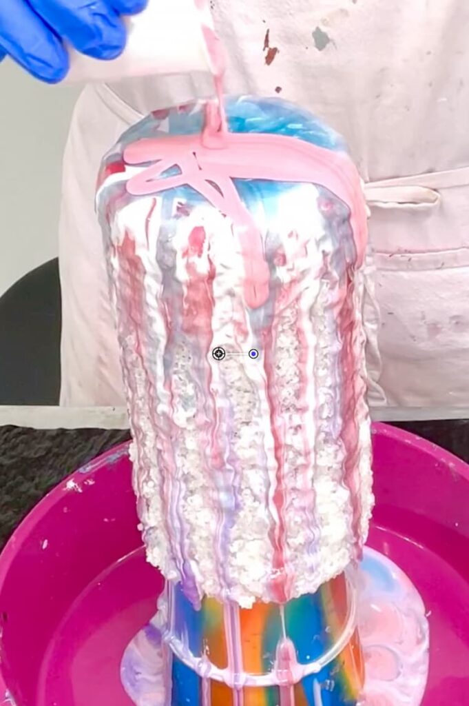 Pouring resin on the vase to make it look like an old fashioned rock candy salt vase