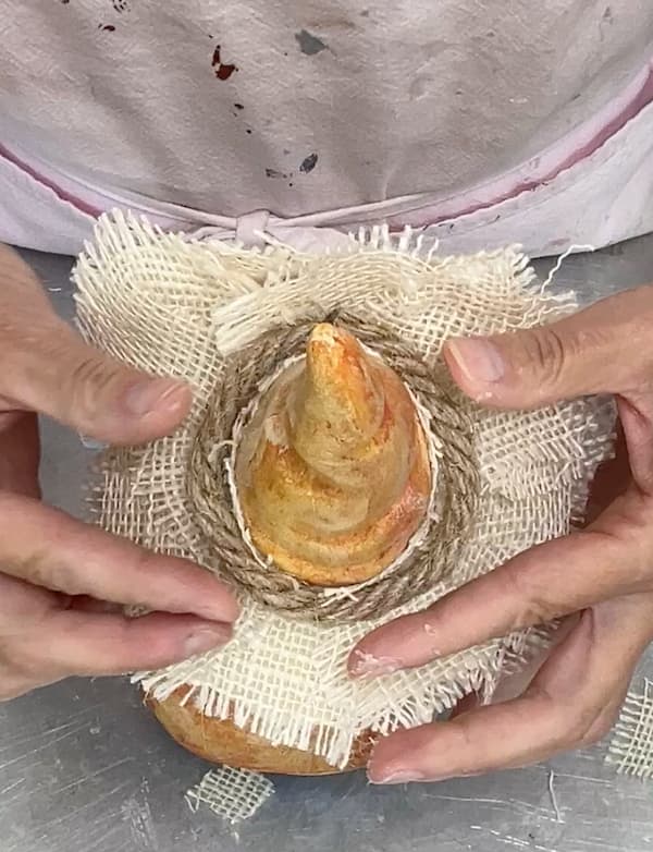 crafting the straw hat for the fall gnome scarecrow decoration out of burlap and rope