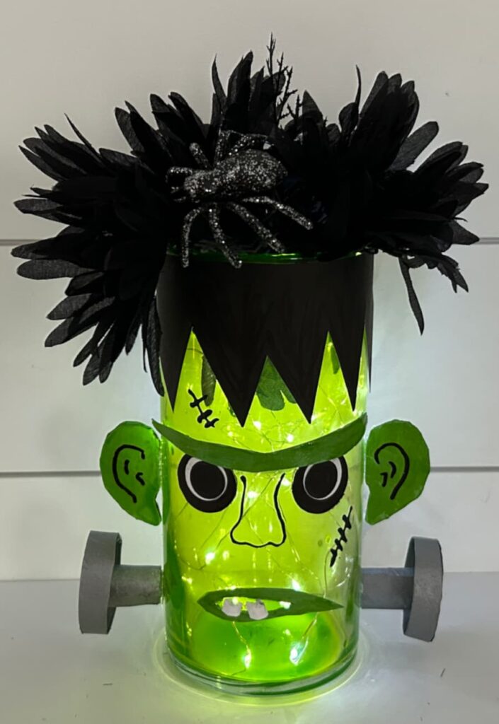 Finished Hallowee Frankenstein Dollar Tree DIY all lit up with crazy hair