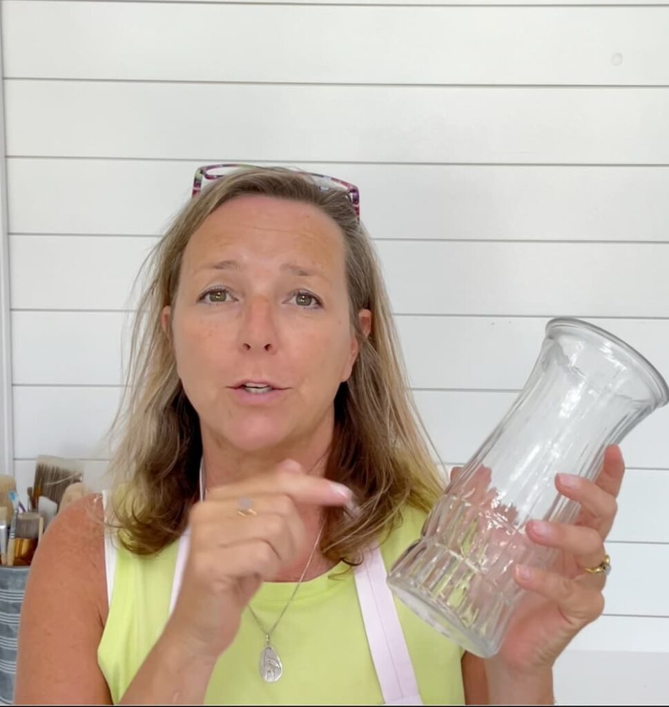 Holding a clear glass vase