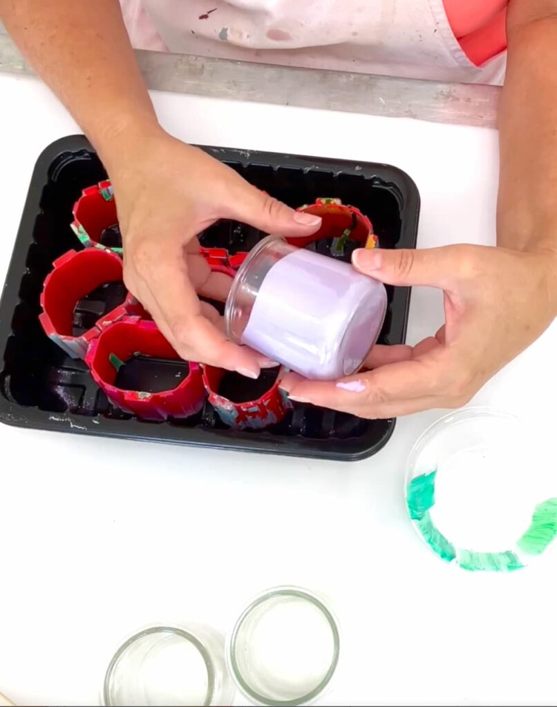 Swirling paint in a glass jar