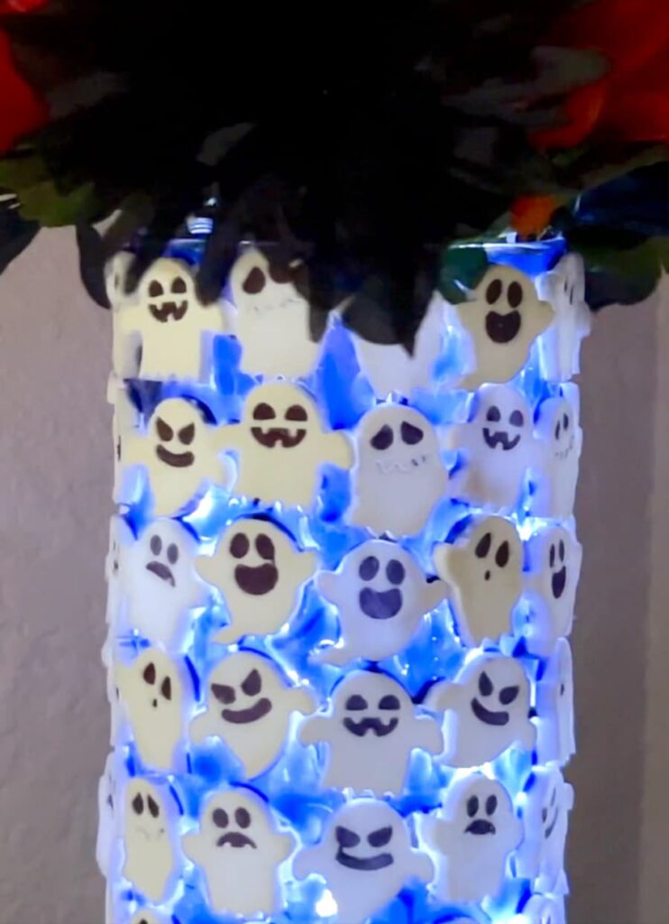 Lit up spooky ghost halloween decoration made with a dollar tree vase