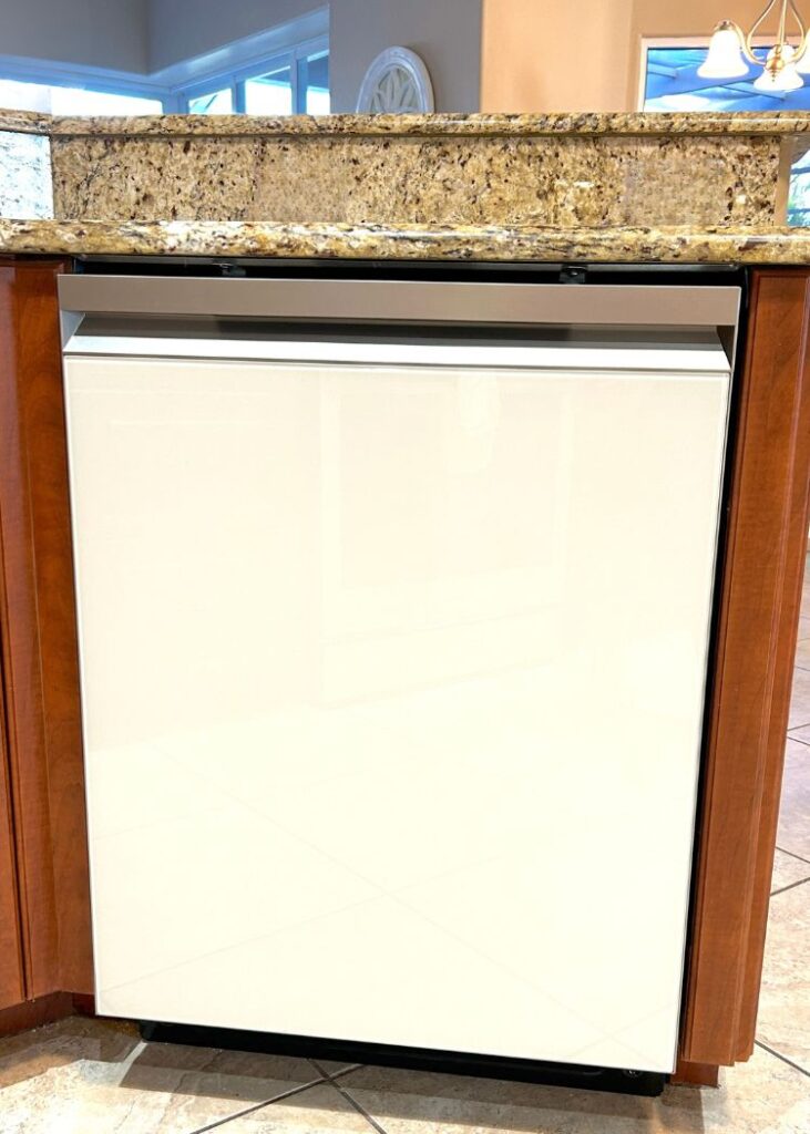  Front of white glass bespoke dishwasher