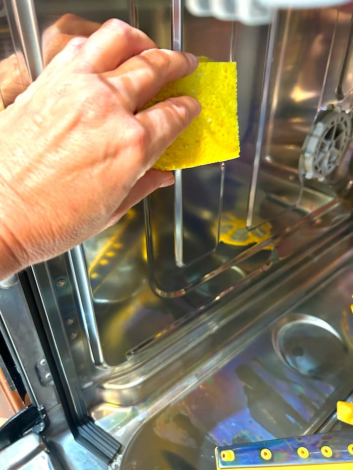 how to clean dishwasher walls with a sponge