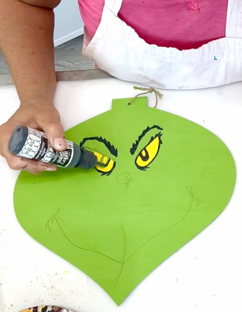 How to make the Grinch ornament by using gallery glass lead paint to outline the features