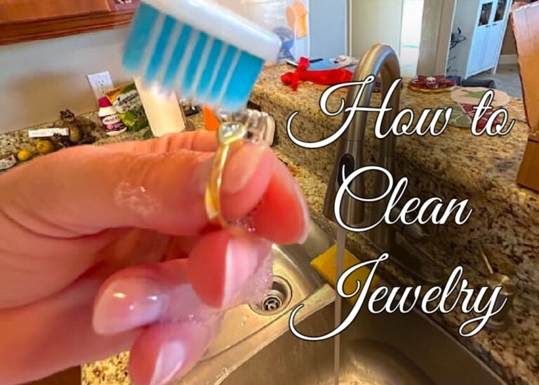 How to Clean Jewelry with hand holding diamond ring and toothbrush scrubbing it