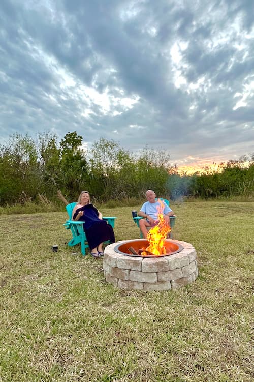 Couple sitting by firepit