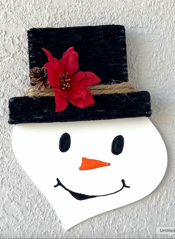 Finished Dollar Tree snowman craft with red flower