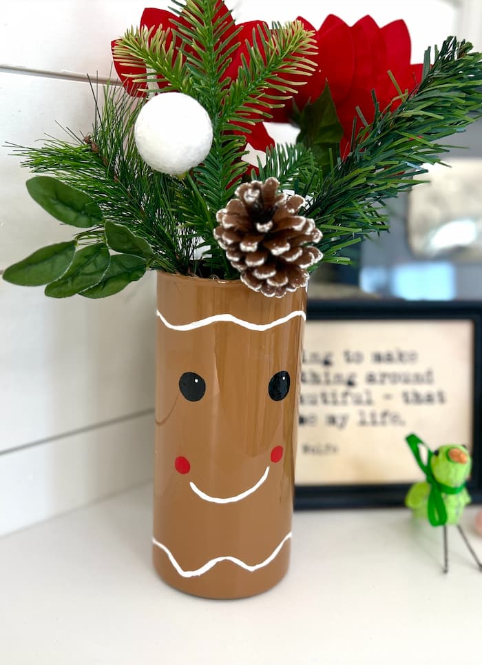 Finished gingerbread man vase after showing how to make a gingerbread man dollar tree christmas craft