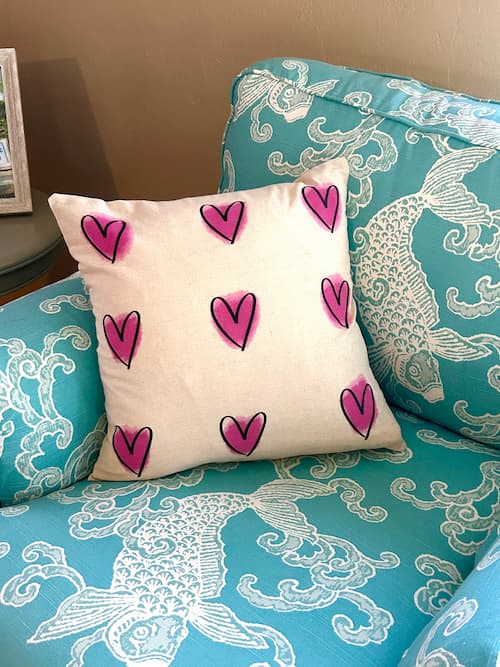 heart valentine's Day pillow on blue chair