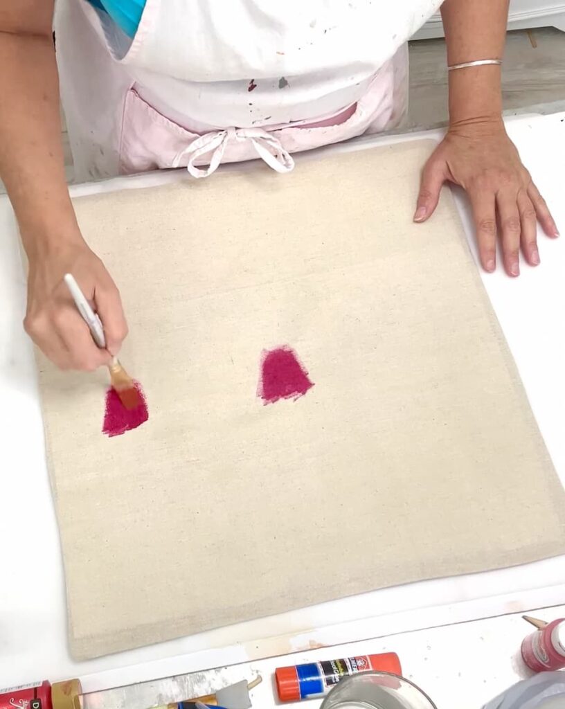 painting hearts on the Valentine's Day pillow cover